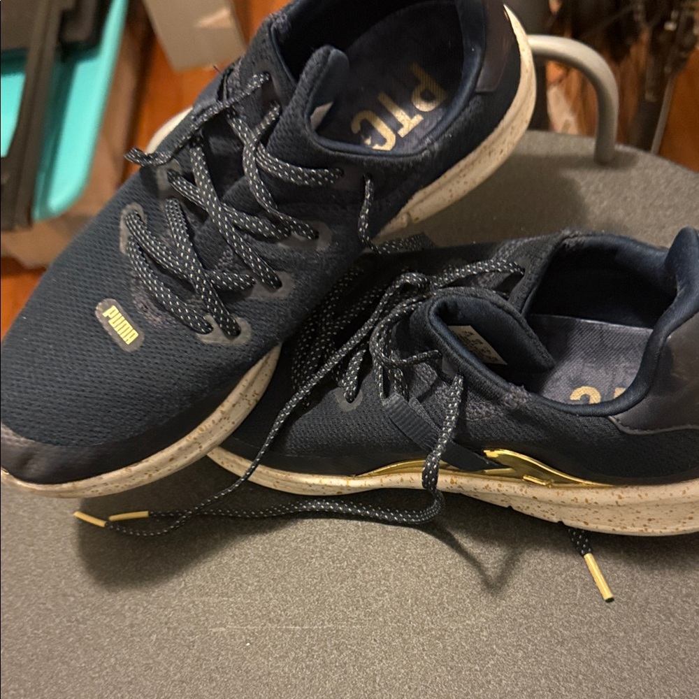 Puma ladies Dark Blue and gold accent Sneakers